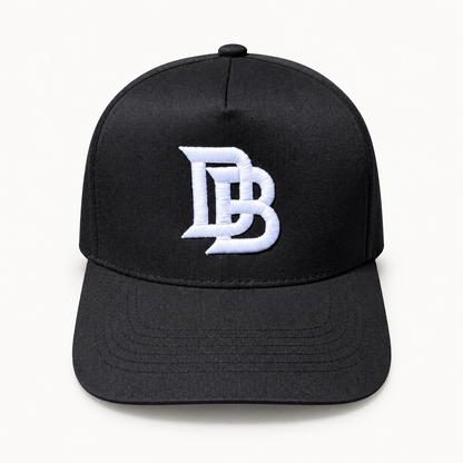 Black DB Snapback, digitally retouched product photograph on a neutral background.